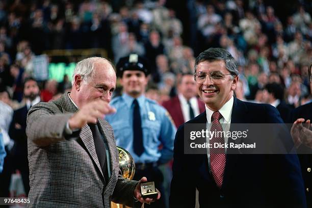 Commissioner David Stern and Boston Celtics President Red Auerbach talk during the 1984 NBA Championship Ring Ceremony prior to a game played against...