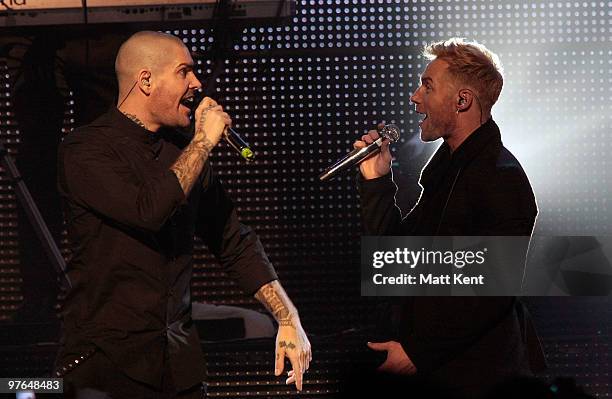 Shane Lynch and Ronan Keating of Boyzone perform at the Royal Albert Hall on March 11, 2010 in London, England.