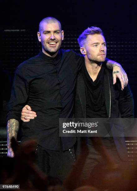 Shane Lynch and Ronan Keating of Boyzone perform at the Royal Albert Hall on March 11, 2010 in London, England.