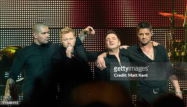 Shane Lynch, Ronan Keating, Mikey Graham and Keith Duffy of Boyzone perform at the Royal Albert Hall on March 11, 2010 in London, England.