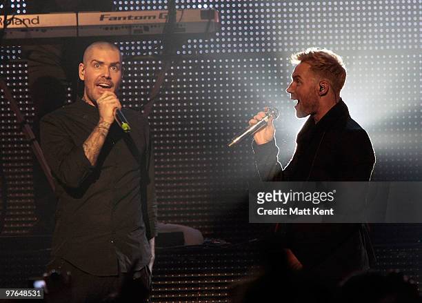 Shane Lynch and Ronan Keating of Boyzone perform at the Royal Albert Hall on March 11, 2010 in London, England.