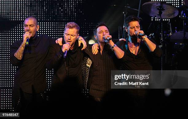 Shane Lynch, Ronan Keating, Mikey Graham and Keith Duffy of Boyzone perform at the Royal Albert Hall on March 11, 2010 in London, England.