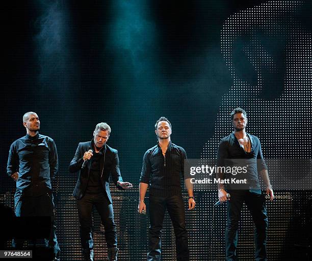 Shane Lynch, Ronan Keating, Mikey Graham and Keith Duffy of Boyzone perform at the Royal Albert Hall on March 11, 2010 in London, England.