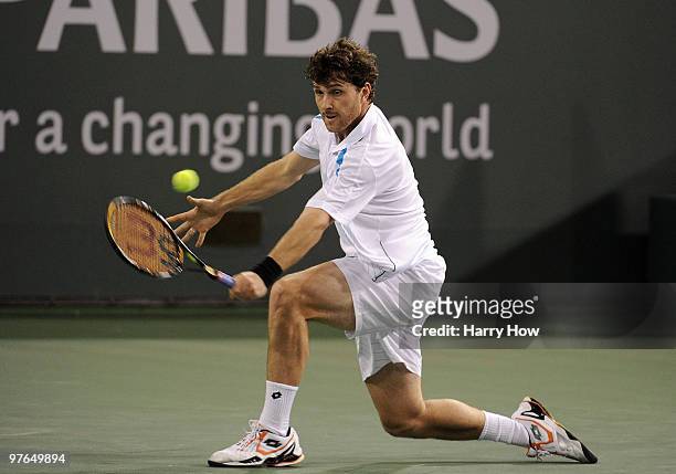 Michael Berrer of Germany hits a backhand in his match against Marty Fish of the United States during the BNP Paribas Open at the Indian Wells Tennis...