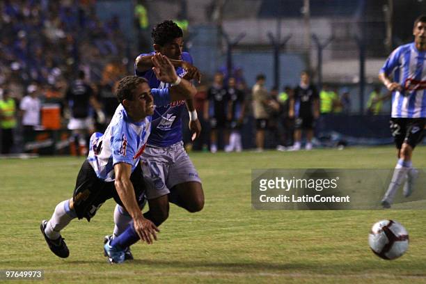 Alejandro Mello of Cerro vies for the ball with Joao Rojas of Emelec during a match as part of the Libertadores Cup 2010 at the George Capwell...