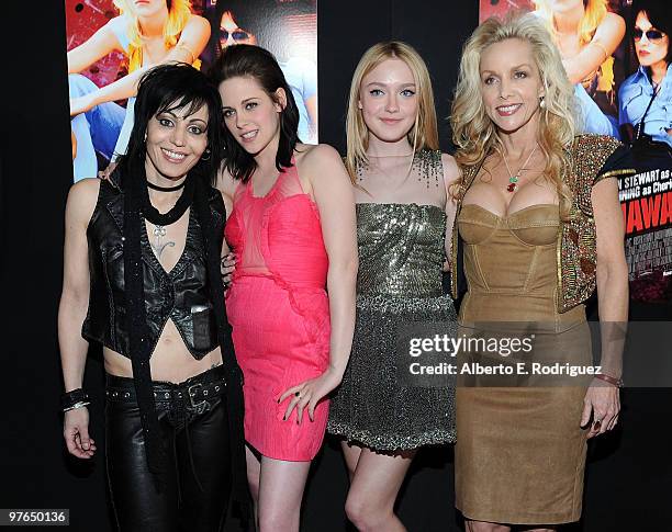 Musician Joan Jett, actresses Kristen Stewart, Dakota Fanning, and musician Cherie Currie arrive at the premiere of Apparition's "The Runaways" held...