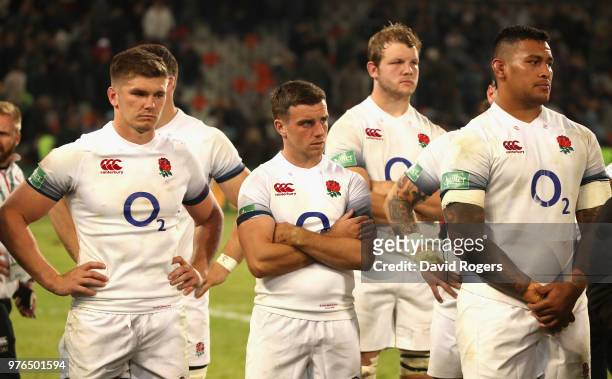 Owen Farrell, the England captain looks on with George Ford, Joe Launchbury and Nathan Hughes after their defeat during the second test match between...
