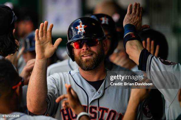 Brian McCann of the Houston Astros celebrates scoring during a three run home run hit by Alex Bregman against the Kansas City Royals during the ninth...