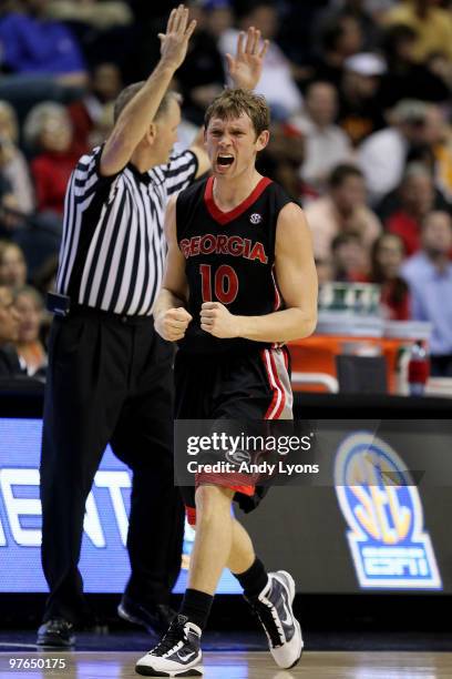 Ricky McPhee of the Georgia Bulldogs reacts after he made a 3-point shot at the buzzer to end the first half against the Arkanasas Razorbacks during...