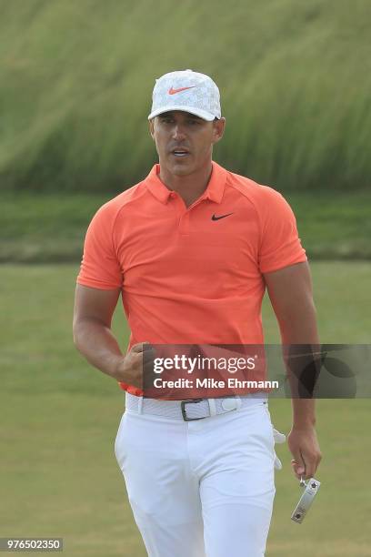 Brooks Koepka of the United States reacts on the 14th green during the third round of the 2018 U.S. Open at Shinnecock Hills Golf Club on June 16,...