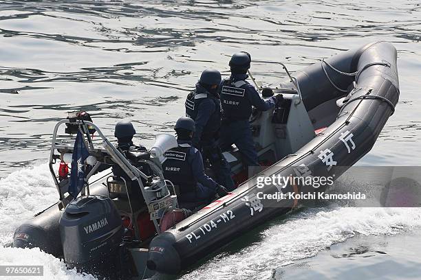 Japan Coast Guard stand on guard the Japan's whaling vessel Shonan Maru 2, detaining a New Zealand anti-whaling activist Peter Bethune, a member of...