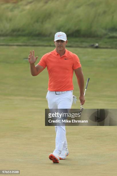 Brooks Koepka of the United States reacts on the 14th green during the third round of the 2018 U.S. Open at Shinnecock Hills Golf Club on June 16,...