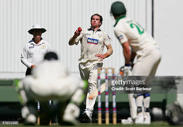 John Hastings of the Bushrangers bowls during day three of the Sheffield Shield match between the Victorian Bushrangers and the Tasmanian Tigers at...