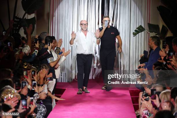 Designer Domenico Dolce and Stefano Gabbana acknowledge the applause of the audience at the Dolce & Gabbana Naked King Secret Show show during Milan...