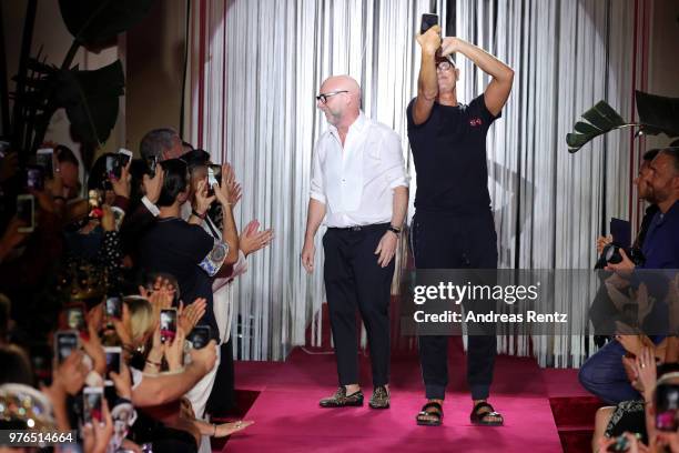 Designer Domenico Dolce and Stefano Gabbana acknowledge the applause of the audience at the Dolce & Gabbana Naked King Secret Show show during Milan...