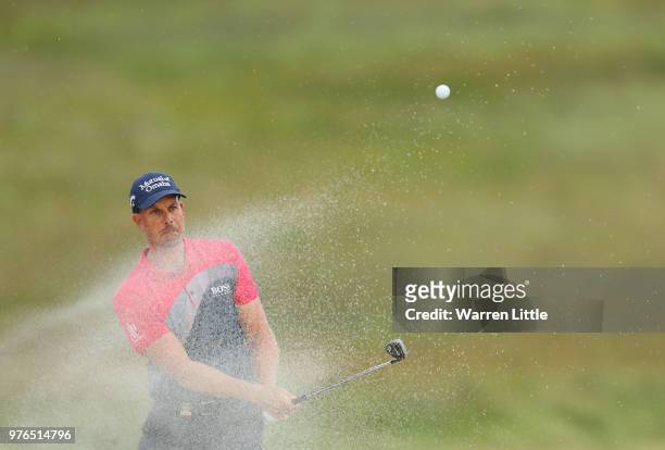 Henrik Stenson of Sweden plays a shot from a bunker on the 15th hole during the third round of the 2018 U.S. Open at Shinnecock Hills Golf Club on...