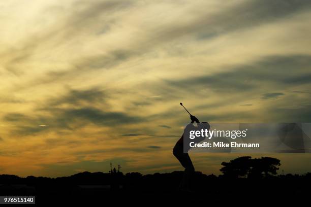 Brooks Koepka of the United States plays his shot from the 17th tee during the third round of the 2018 U.S. Open at Shinnecock Hills Golf Club on...