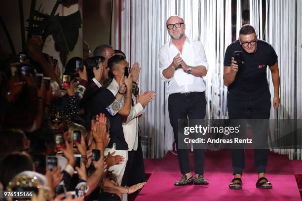 Designer Domenico Dolce and Stefano Gabbana acknowledge the applause of the audience at the Dolce & Gabbana Naked King Secret Show show during Milan...