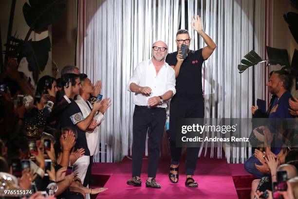 Designer Domenico Dolce and Stefano Gabbana acknowledge the applause of the audience at the Dolce & Gabbana Naked King Secret Show show during Milan...