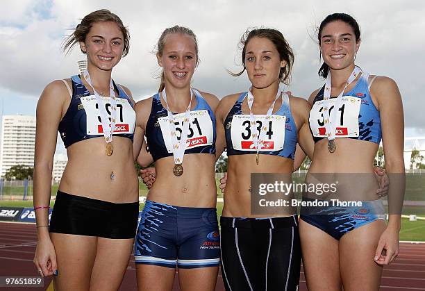 Ella Nelson, Rebecca Watts, Karlie Morton and Michelle Jenneke of NSW pose after winning the Girls 4x100 metre Relay Under 18 during day two of the...