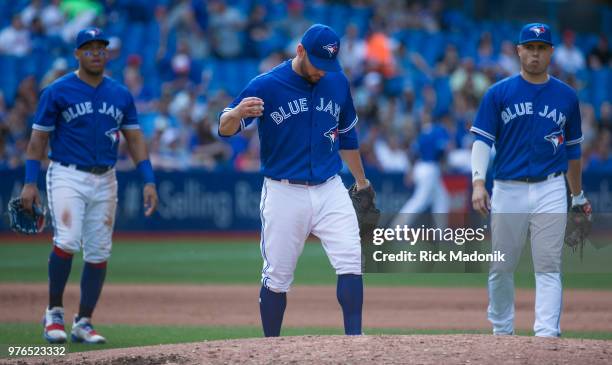 Toronto Blue Jays starting pitcher Marco Estrada heads back to the mound but already knows Manager John Gibbons is on his way to relieve him of duty....