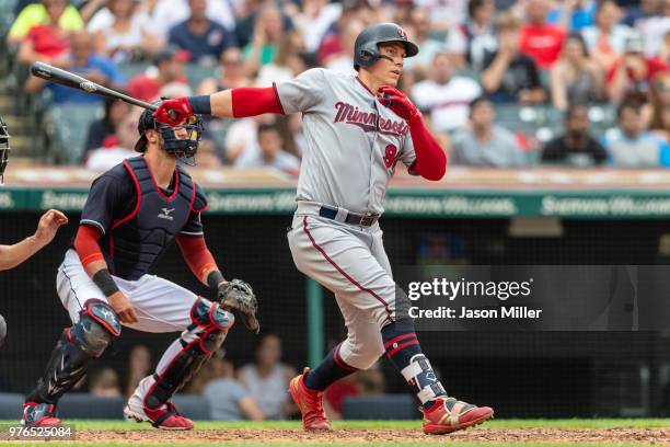 Logan Morrison of the Minnesota Twins hits a two RBI double during the sixth inning against the Cleveland Indians at Progressive Field on June 16,...