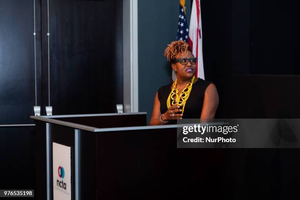 Tia Smith, Exec. In Charge of Production and Sr. Dir. Of Programming and Production, TV One, , talks to guests at the screening of TV Ones Evidence...