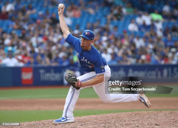 Tyler Clippard of the Toronto Blue Jays delivers a pitch in the ninth inning during MLB game action against the Washington Nationals at Rogers Centre...