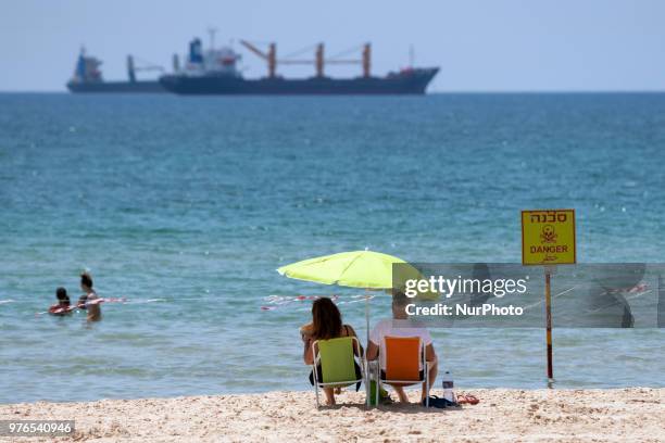 Israelis cool off on the beach as a heat wave hits the port town of Ashdod, Israel on June 16, 2018. Ashdod, a popular beach town with the largest...