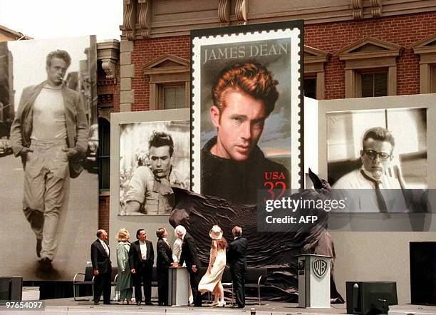 Warner Brothers studio and US Postal Service officials watch as the James Dean stamp is unveiled on the Warner Brother's Midwestern Street studio lot...