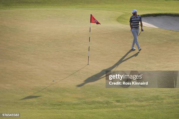 Dustin Johnson of the United States walks on the 18th green during the third round of the 2018 U.S. Open at Shinnecock Hills Golf Club on June 16,...