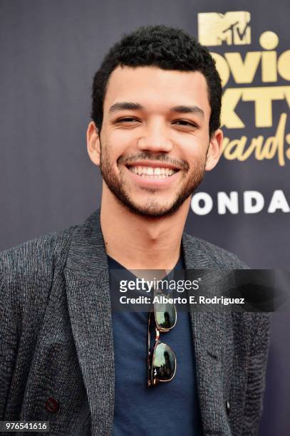 Actor Justice Smith attends the 2018 MTV Movie And TV Awards at Barker Hangar on June 16, 2018 in Santa Monica, California.