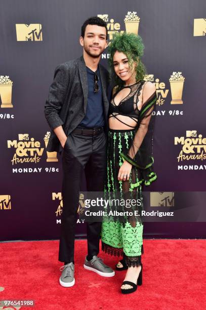 Actor Justice Smith and singer Cameo Adele attend the 2018 MTV Movie And TV Awards at Barker Hangar on June 16, 2018 in Santa Monica, California.