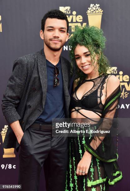 Actor Justice Smith and singer Cameo Adele attend the 2018 MTV Movie And TV Awards at Barker Hangar on June 16, 2018 in Santa Monica, California.