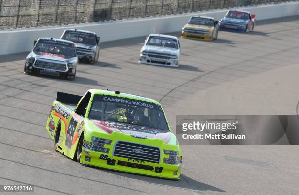 Matt Crafton, driver of the Jack Links/Menards Ford, leads a pack of trucks during the NASCAR Camping World Truck Series M&M's 200 presented by...