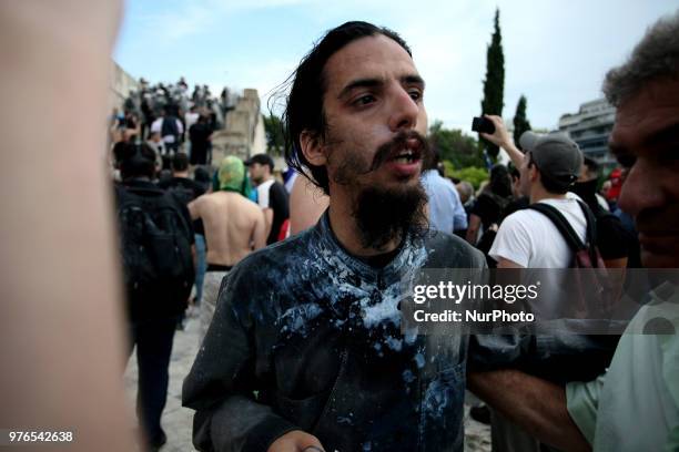 Protesters clash with riot police during a demonstration against the agreement between Greece and FYROM, outside the Greek Parliament in Athens,...