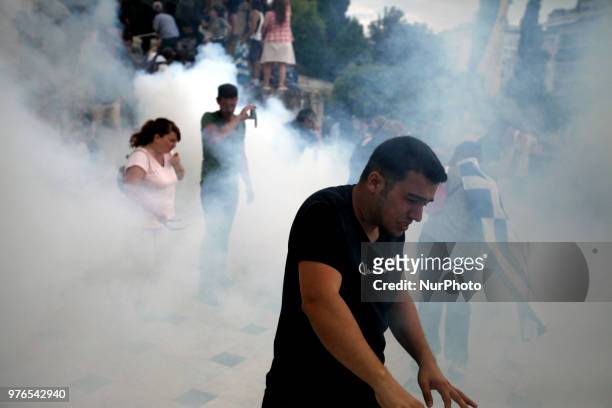Protesters clash with riot police during a demonstration against the agreement between Greece and FYROM, outside the Greek Parliament in Athens,...