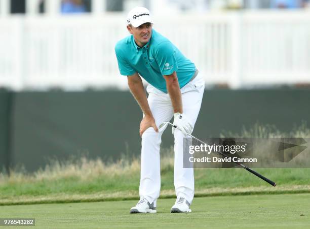 Justin Rose of England reacts to his third shot on the 16th hole during the third round of the 2018 US Open at Shinnecock Hills Golf Club on June 16,...