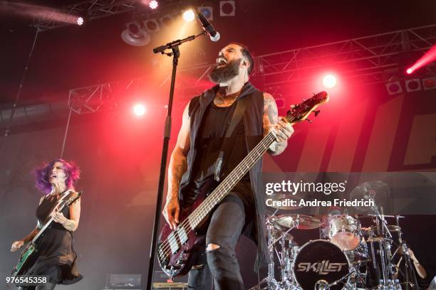 Korey Cooper and John Cooper of Skillet perform live on stage during a concert at Huxleys Neue Welt Berlin on June 16, 2018 in Berlin, Germany.