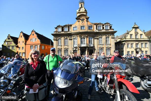 Motorcyclists stand with their bikes during the "Biker Gottesdienst" at the Marktplatz in front of the town hall in Schwäbisch Hall, Germany, 08...