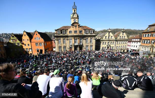 Motorcyclists stand with their bikes during the "Biker Gottesdienst" at the Marktplatz in front of the town hall in Schwäbisch Hall, Germany, 08...