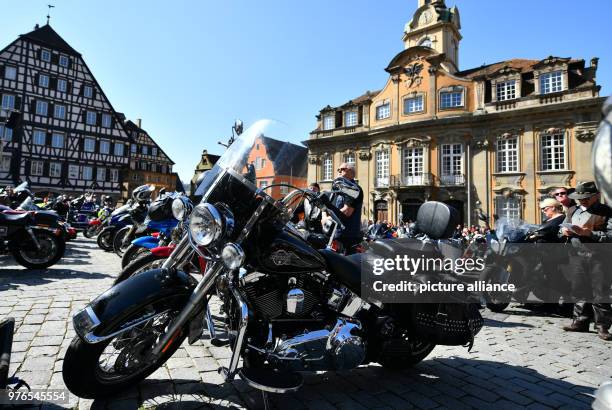 Motorcyclists stand with their bikes during the "Biker Gottesdienst" at the Marktplatz in front of the town hall in Schwäbisch Hall, Germany, 08...