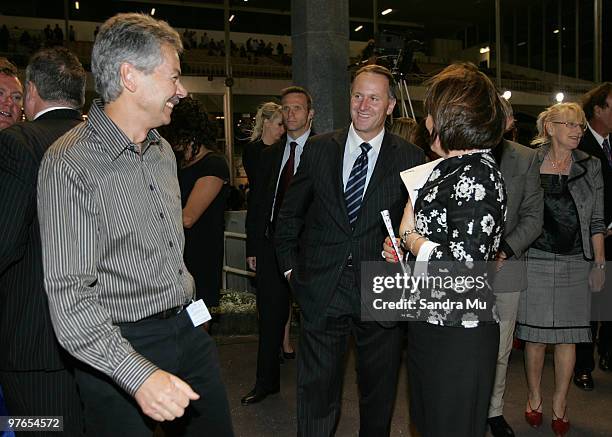 New Zealand Prime Minister John Key congratulates Brendon Hill , the owner of Auckland Cup winner Monkey King during the Auckland Trotting Cup...