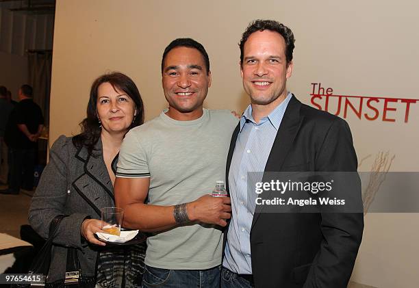 Michele Mulroney, photographer Paul Robinson and actor Diedrich Bader attend the opening night reception of Paul Robinson's 'Transparent' at Sunset...