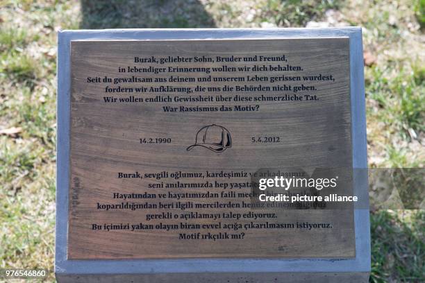 April 2018, Germany, Berlin: A plaque in front of the memorial for Burak.B. The young man was shot in a street in Neukoelln on 05 April 2012. The...