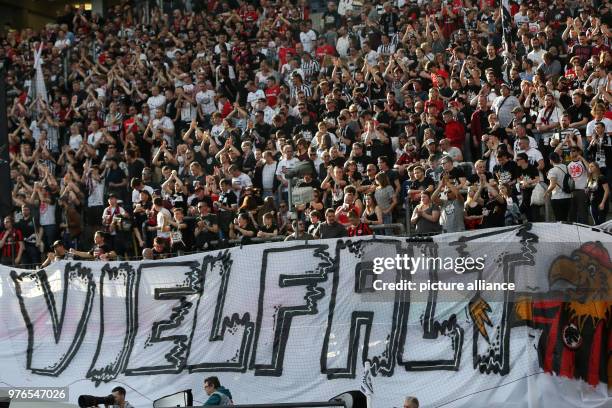 April 2018, Germany, Frankfurt: Soccer, Bundesliga, Eintracht Frankfurt vs 1899 Hoffenheim at the Commerzbank arena. Frankfurt's fans showing a...