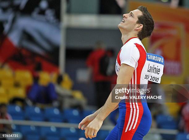 France's Renaud Lavillenie reacts after missing his third attemps in the men's pole vault qualifying round at the 2010 IAAF World Indoor Athletics...