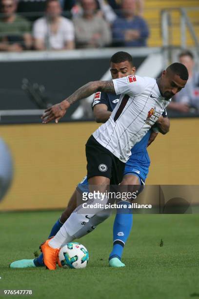 Frankfurt's Kevin Prince Boateng and Hoffenheim's Kevin Akpoguma vie for the ball during the German Bundesliga soccer match between Eintracht...