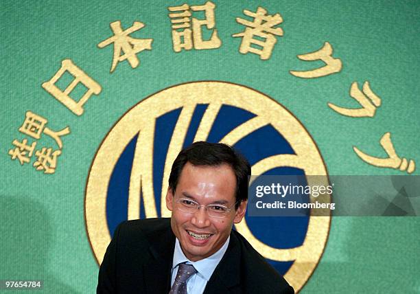 Korn Chatikavanij, Thailand's finance minister, takes a seat at the start of a news conference at the Japan National Press Club in Tokyo, Japan, on...