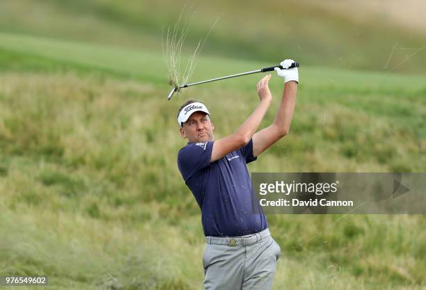 Ian Poulter of England plays his second shot on the 15th hole during the third round of the 2018 US Open at Shinnecock Hills Golf Club on June 16,...